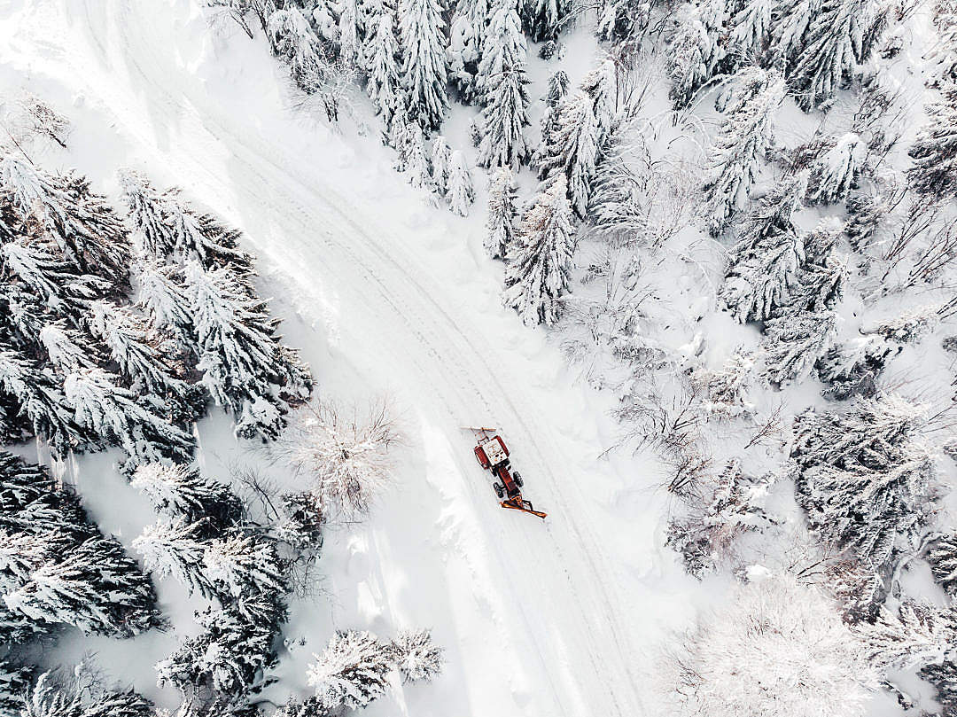 Aerial Drone Shot of a Snowy Road