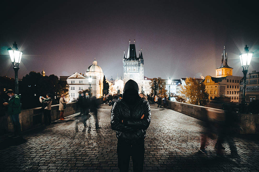 Anonymous Man with Crossed Arms Standing on Charles Bridge