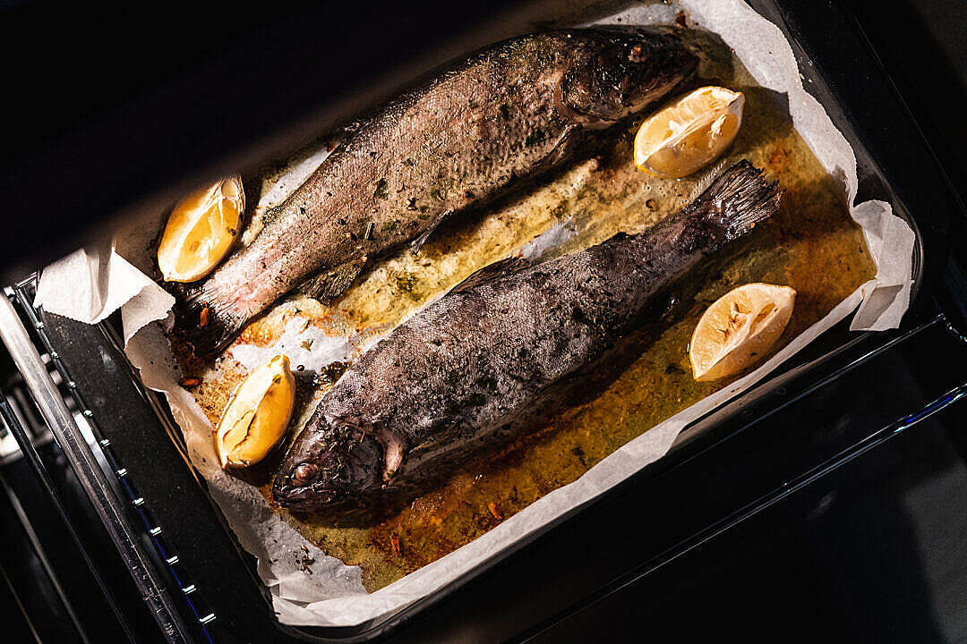 Download Baked Trout on Butter and Herbs with Lemon FREE Stock Photo