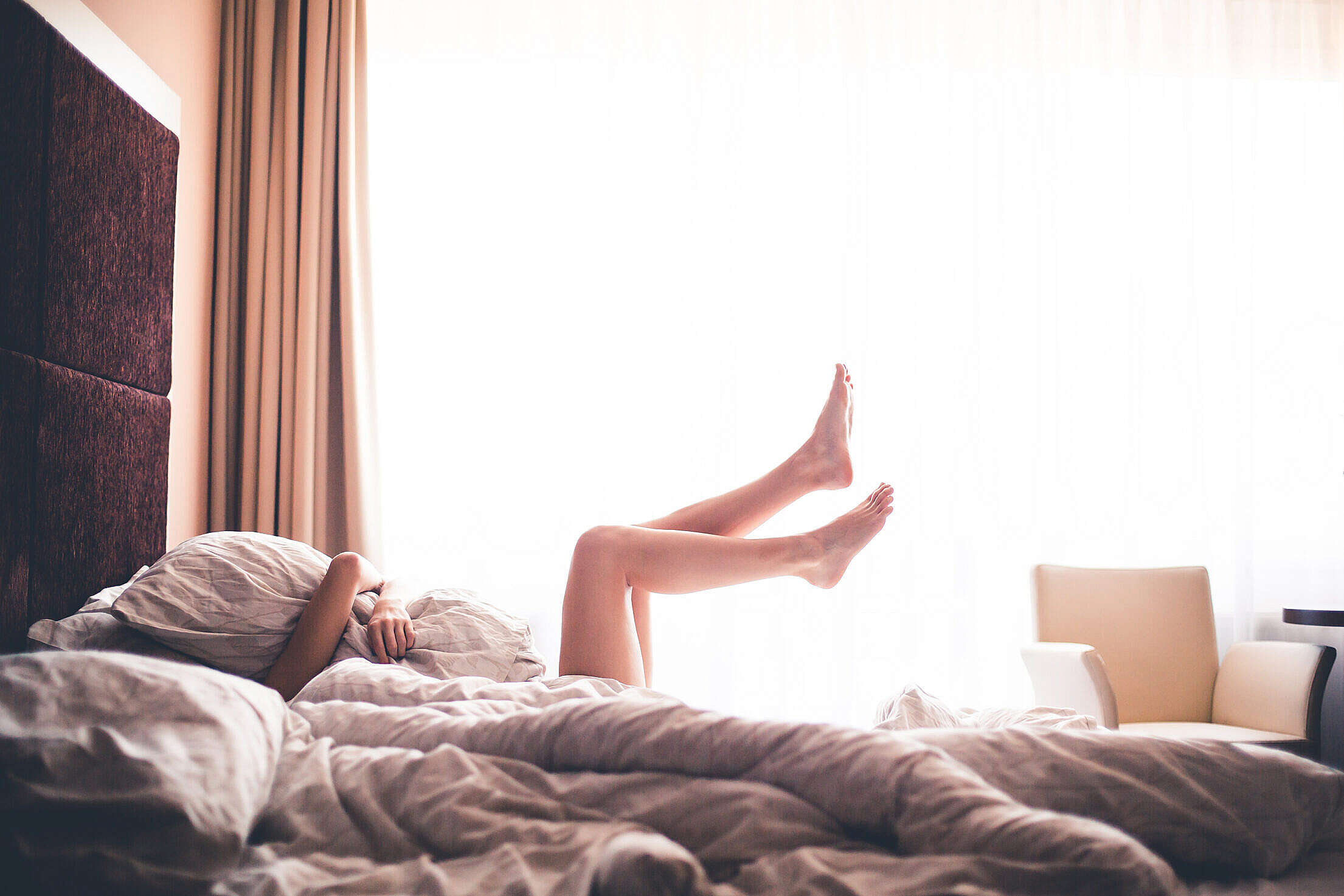 Beautiful Woman Enjoying Morning Relax in Bed Free Stock Photo