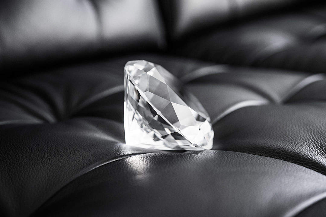 Download Big Glass Diamond Crystal on Black Leather Sofa FREE Stock Photo