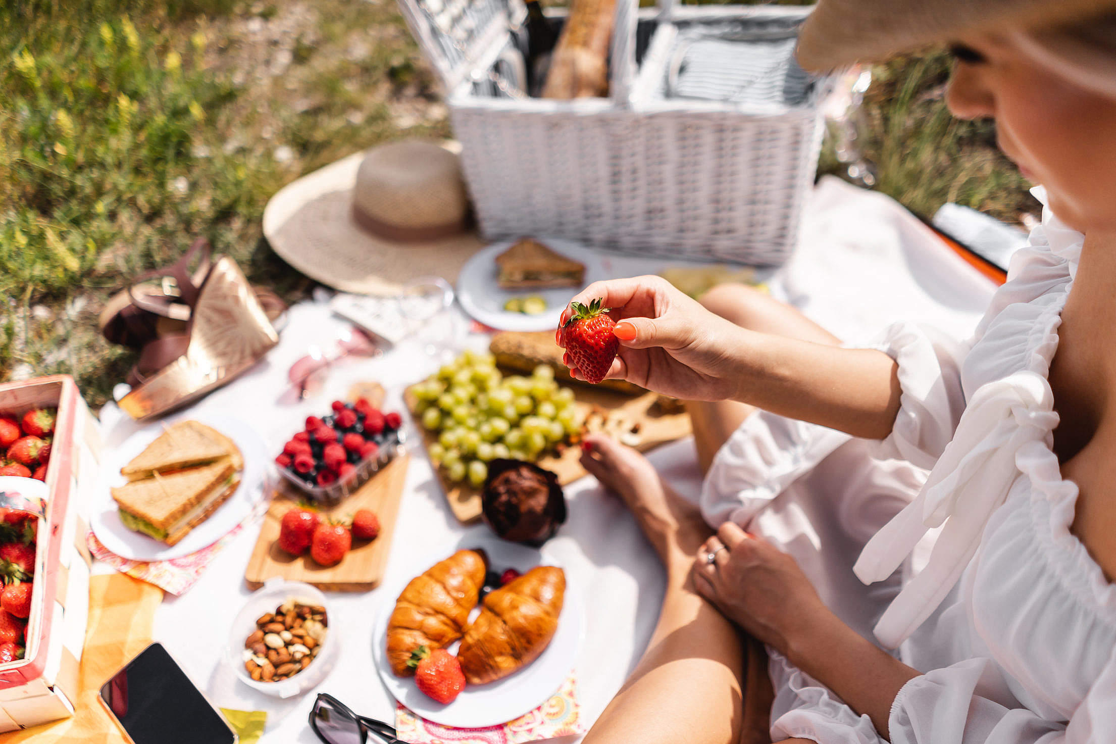 Blanket with Food Prepared for Summer Picnic Outdoors Free Stock Photo