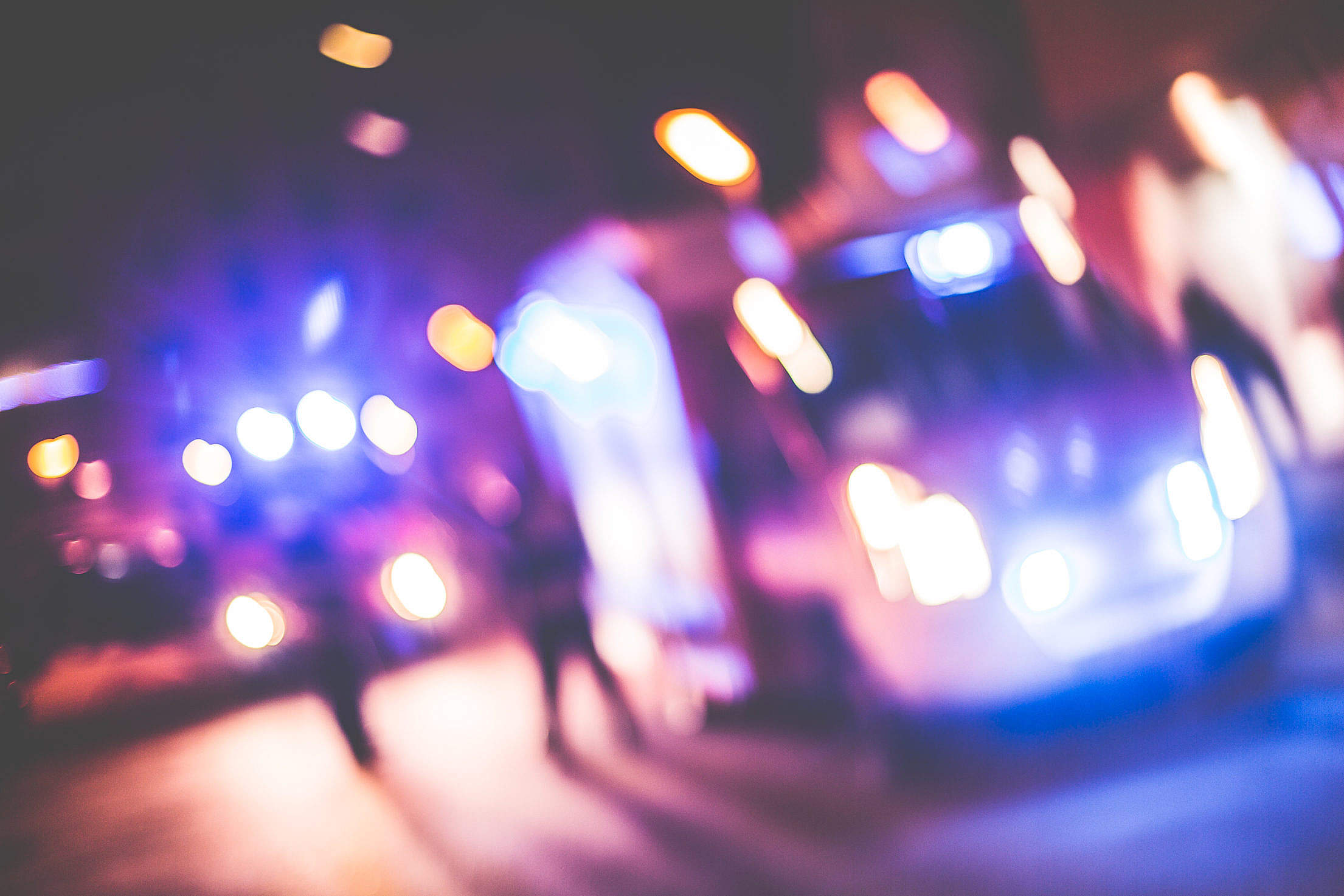 Blurred Emergency Cars At Night Free Stock Photo