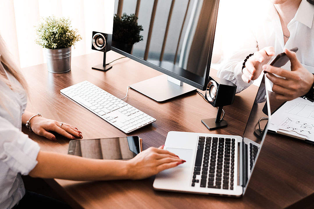 Download Business Brainstorming Between Man and Woman in the Office FREE Stock Photo