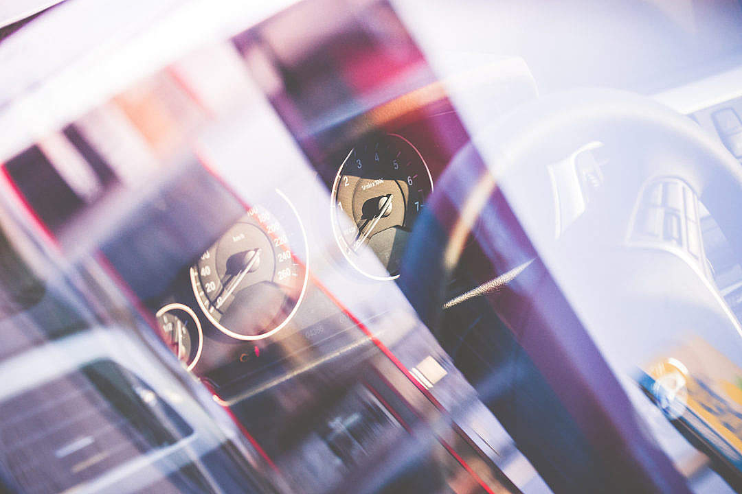 Car Dashboard in Abstract City Reflections