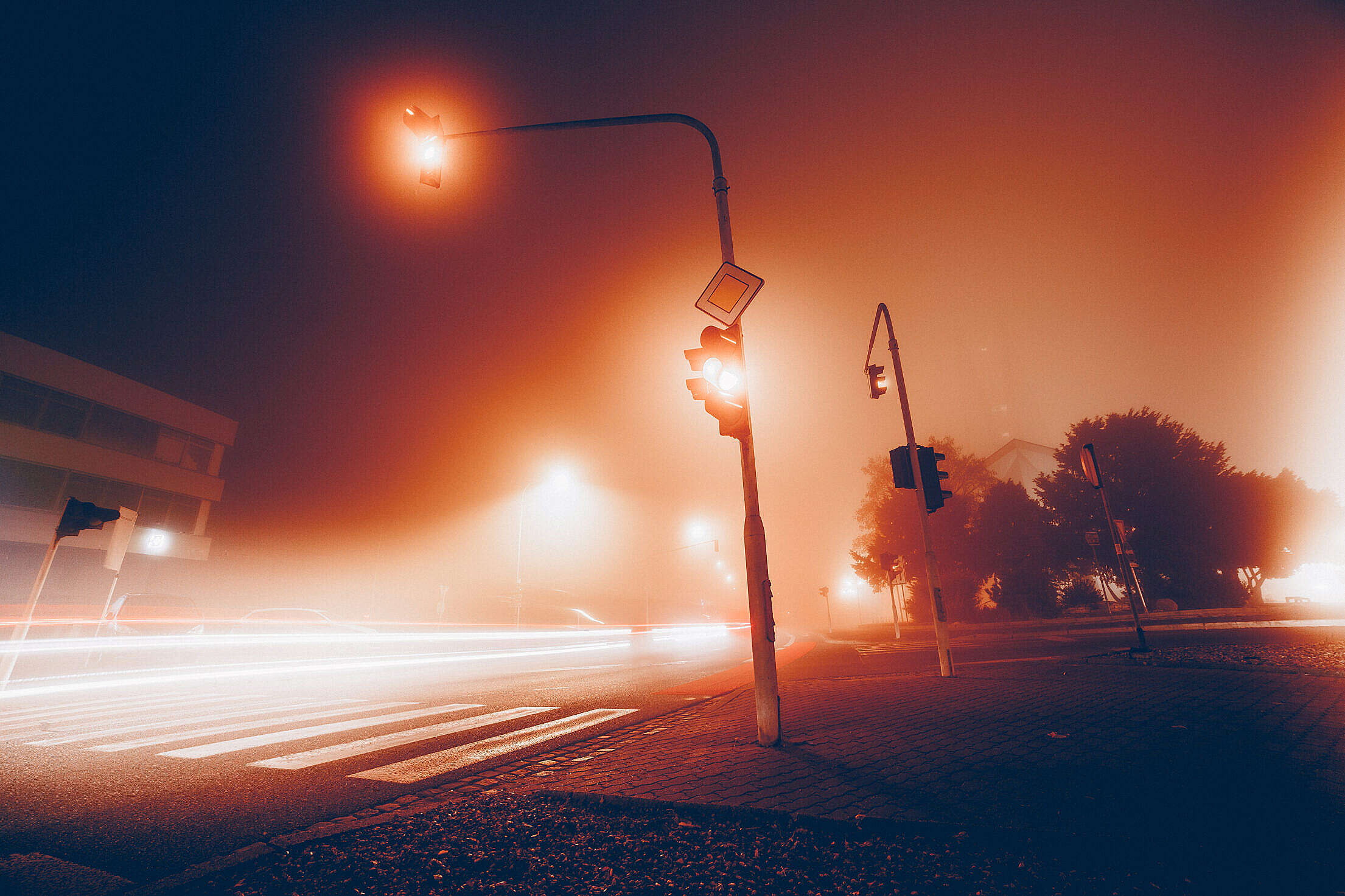 Car Lights & Crossroad Traffic Lights in The Fog Free Stock Photo