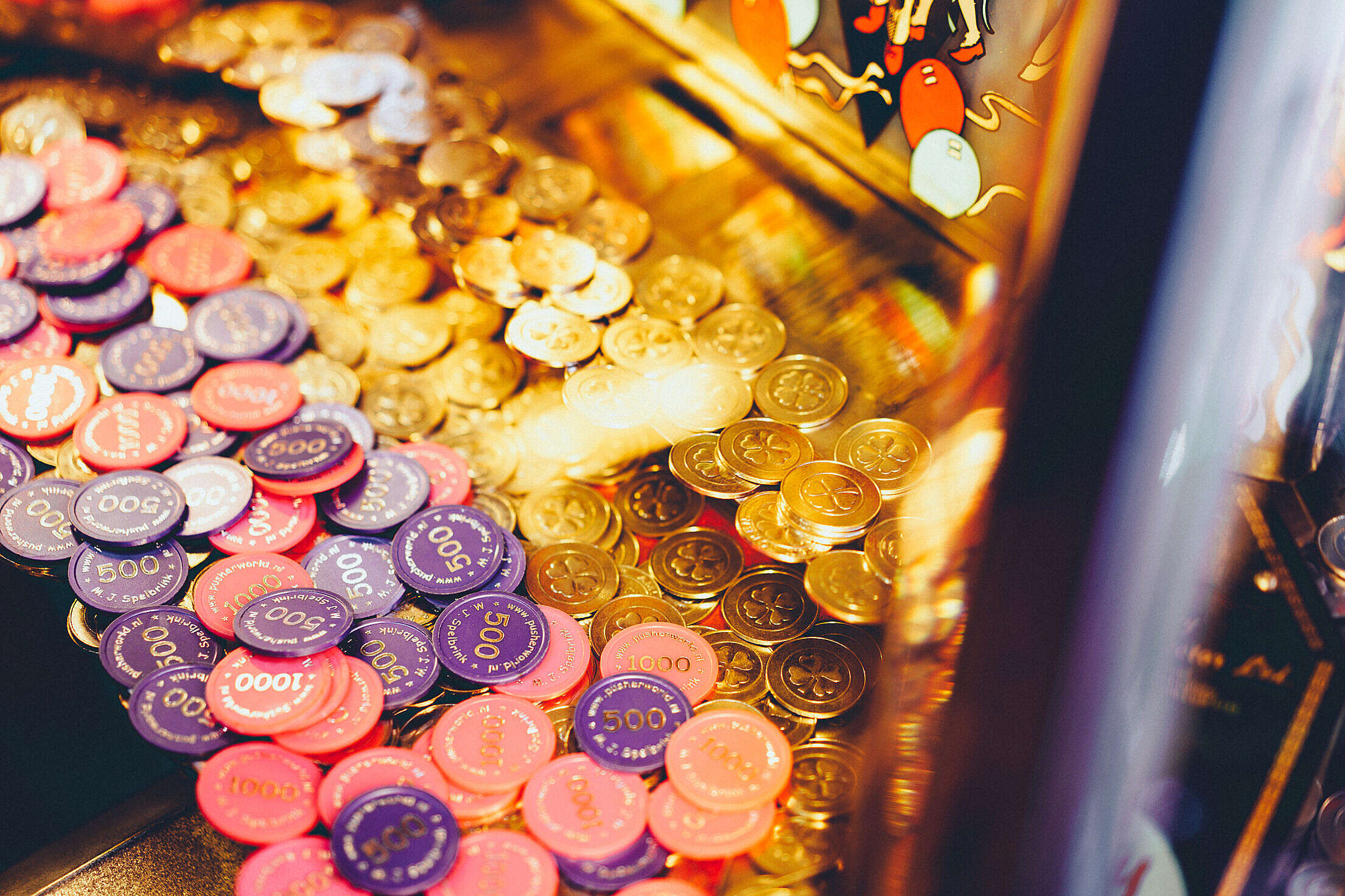 Casino Slot Machine with Coins and Game Chips Free Stock Photo