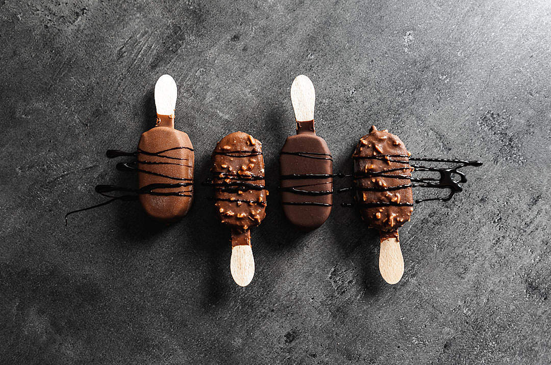 Download Chocolate Popsicles on Black Background FREE Stock Photo