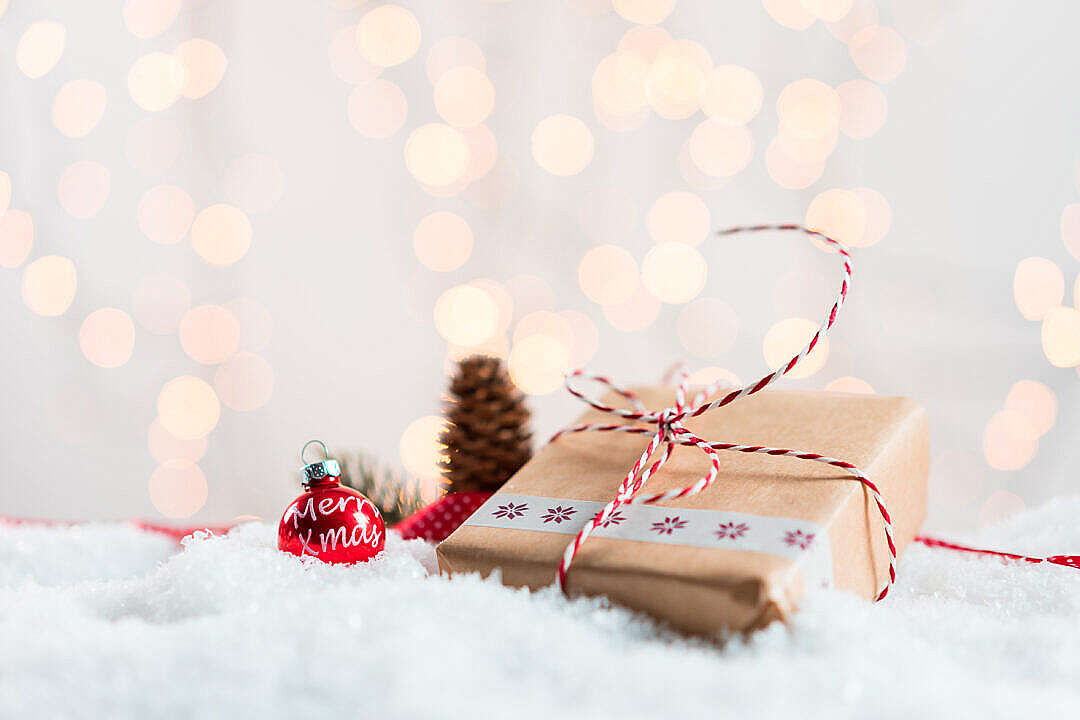 Christmas Present in Snow with Bokeh Background