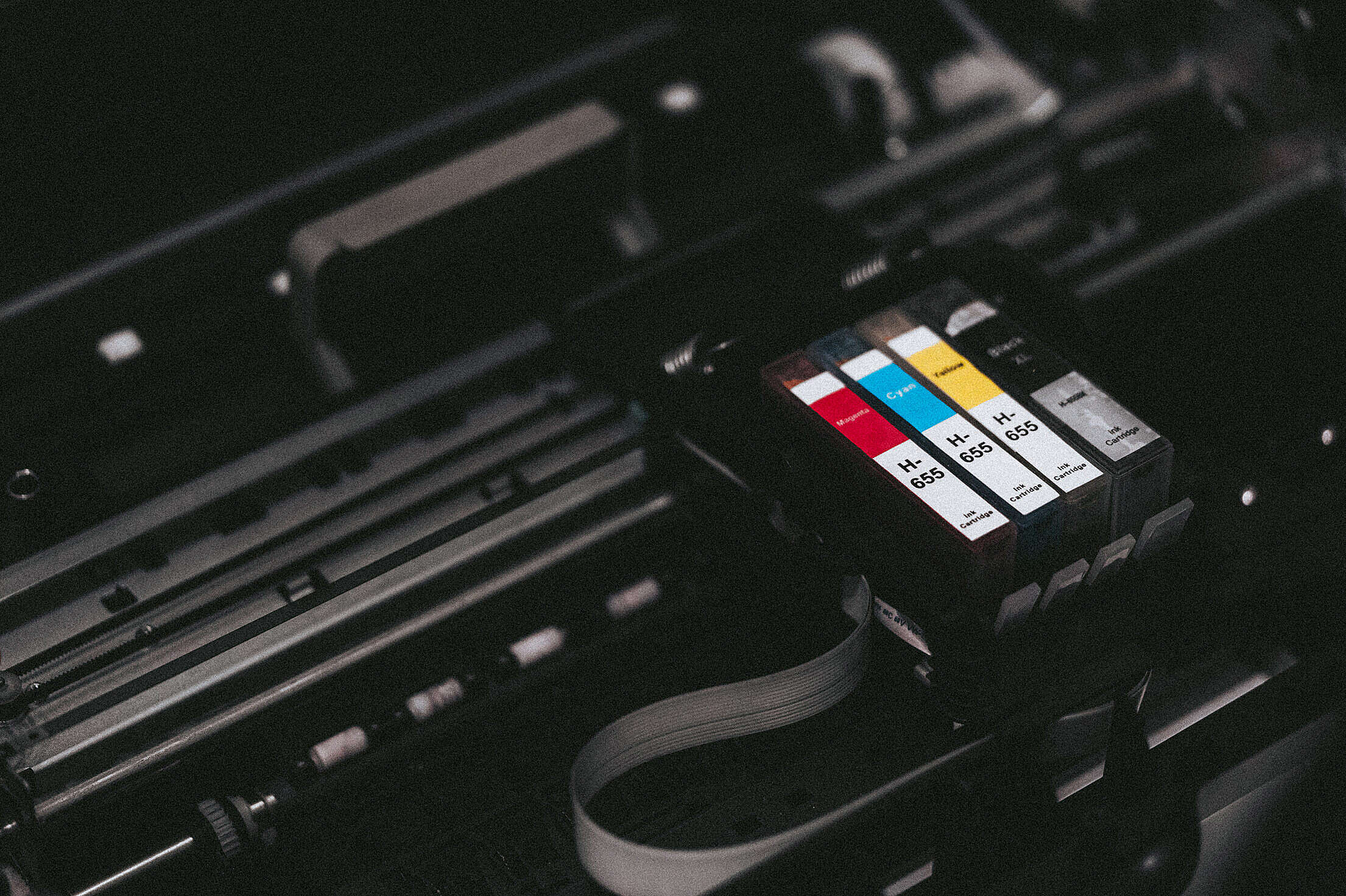 CMYK Ink Cartridges in a Printer Free Stock Photo