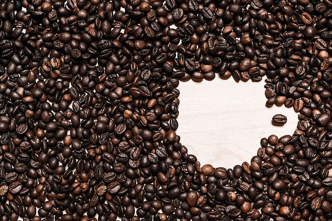 Download Coffee Cup Shape in Coffee Beans FREE Stock Photo