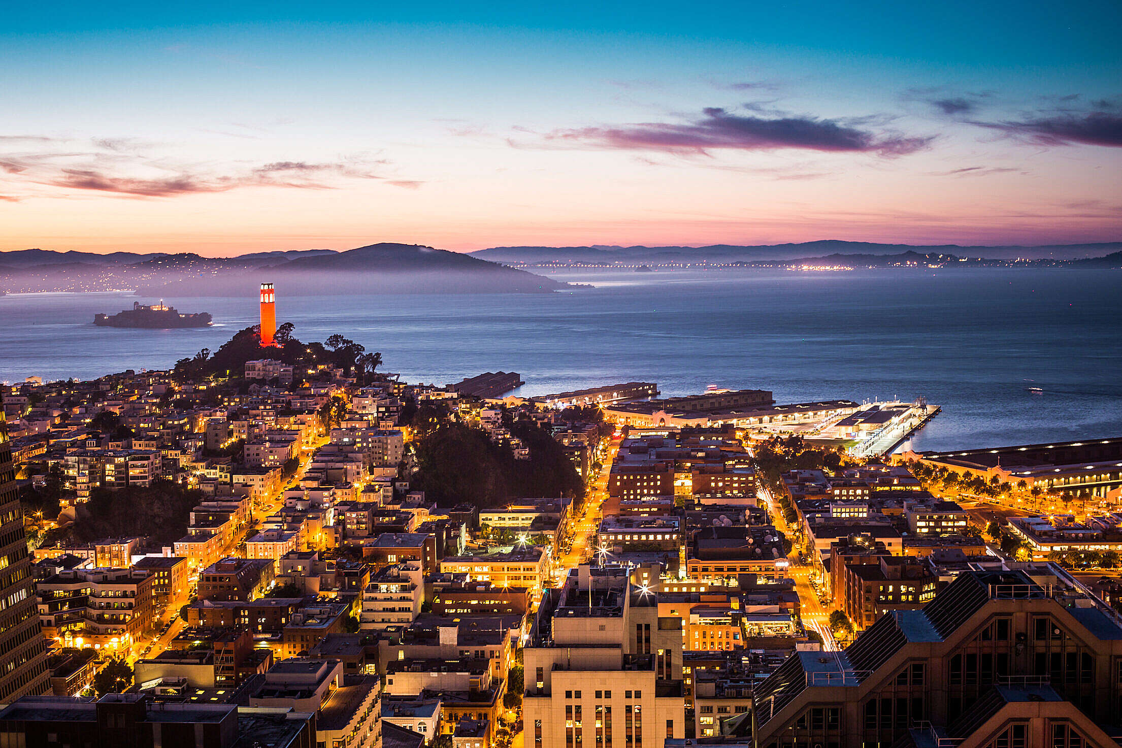 Coit Tower, Alcatraz and Part of San Francisco Bay At Night Free Stock Photo