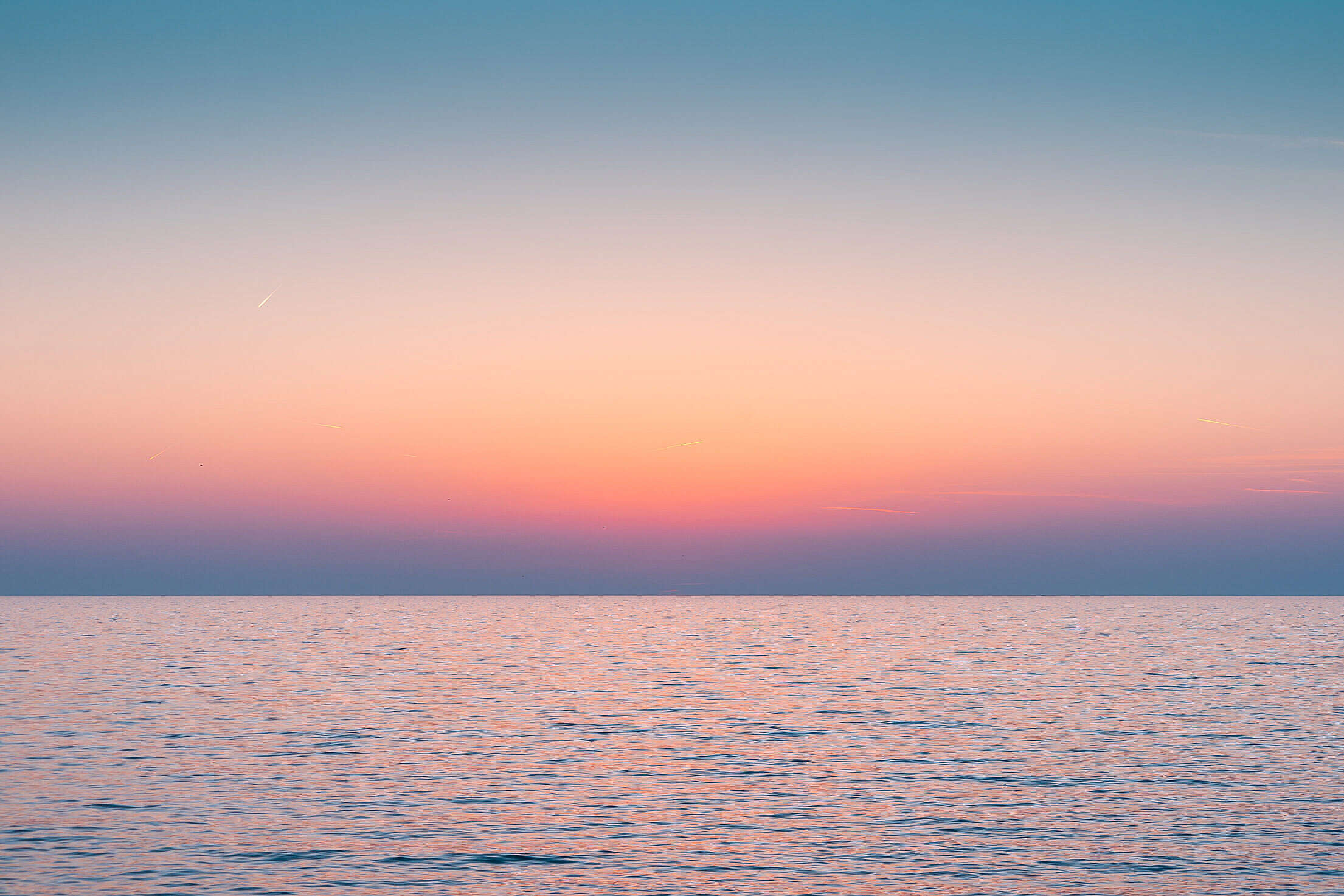 Colorful Dawn Sky Above The Calm Sea Horizon Free Stock Photo