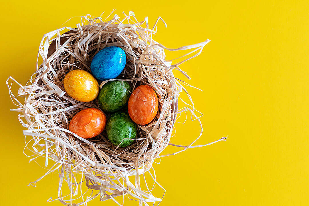 Colorful Easter Eggs on Yellow Background