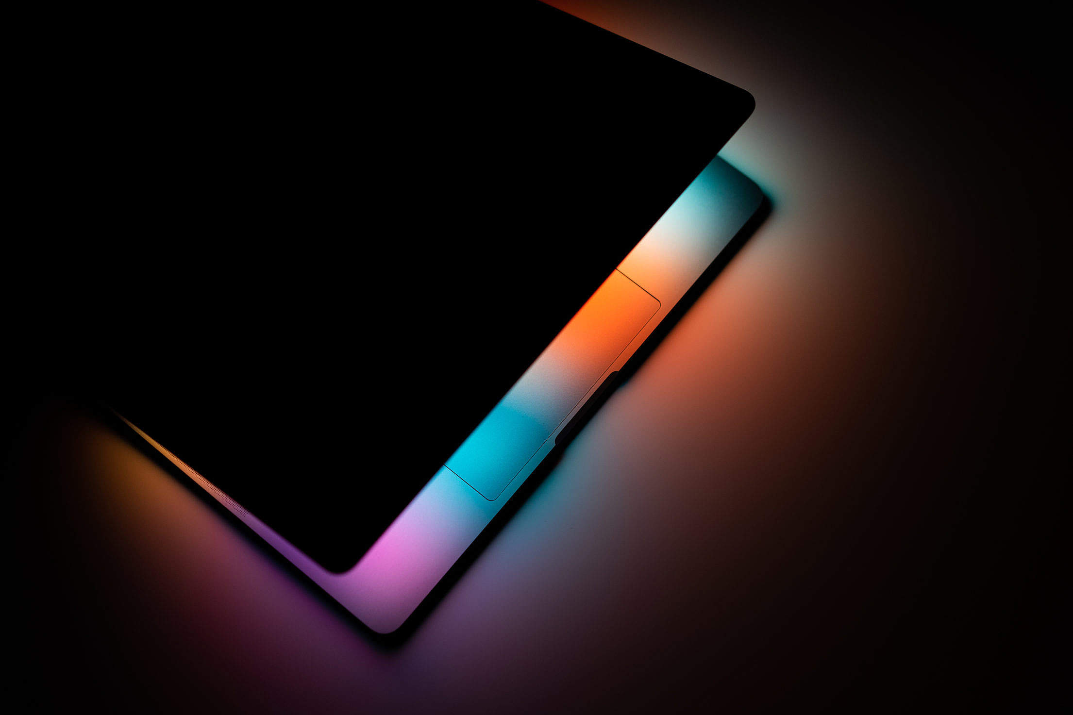 Colorful Lights Shines from MacBook Pro Free Stock Photo