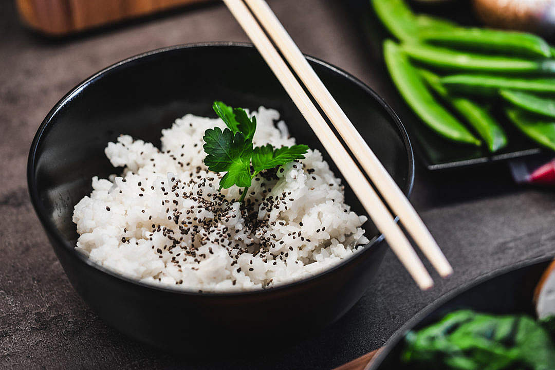 Cooked Jasmine Rice with Black Sesame and Chopsticks