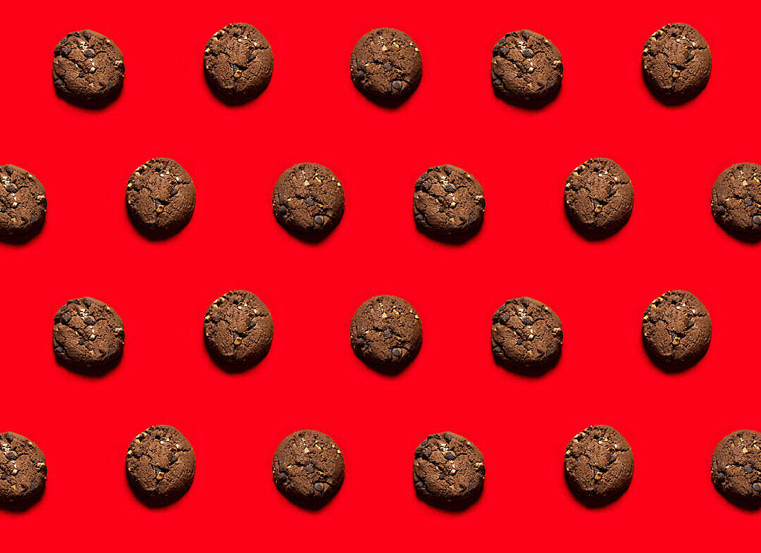 Download Cookies Flat Lay with Red Background FREE Stock Photo