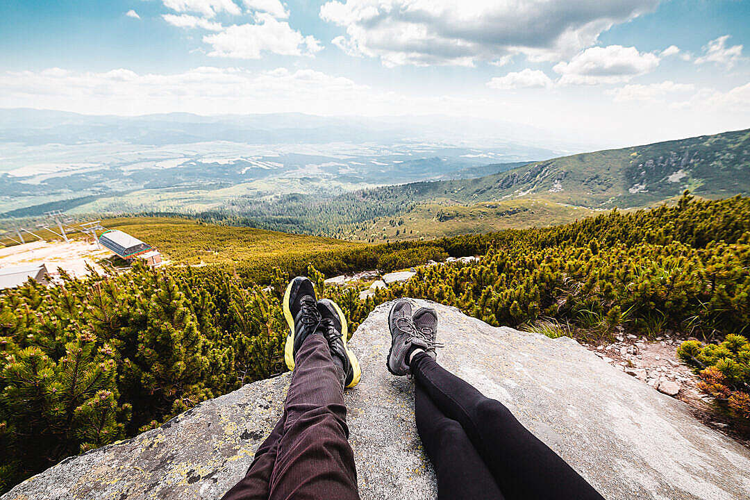 Couple Relaxing After Mountain Hiking