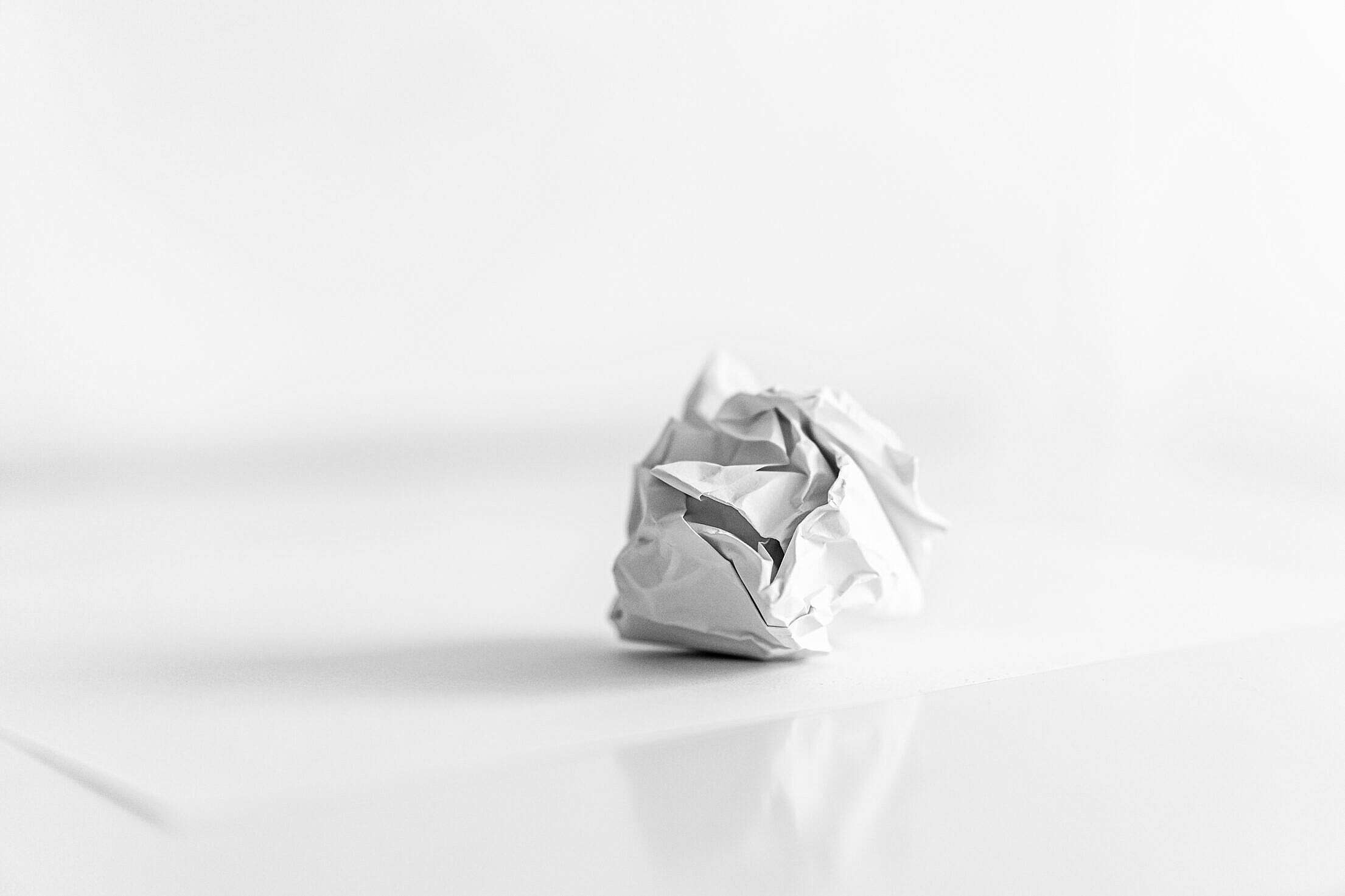 Crumpled Paper Ball on the Table Free Stock Photo