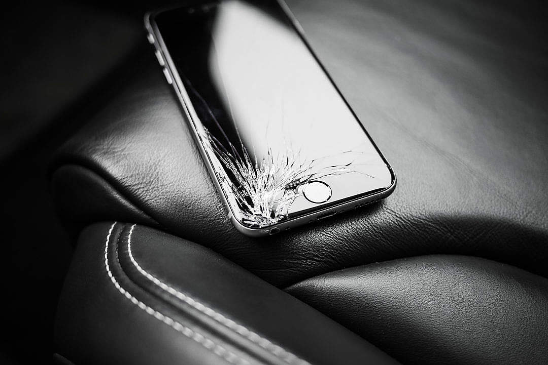 Download Dropped iPhone 6 with Cracked Screen on Car Seat FREE Stock Photo