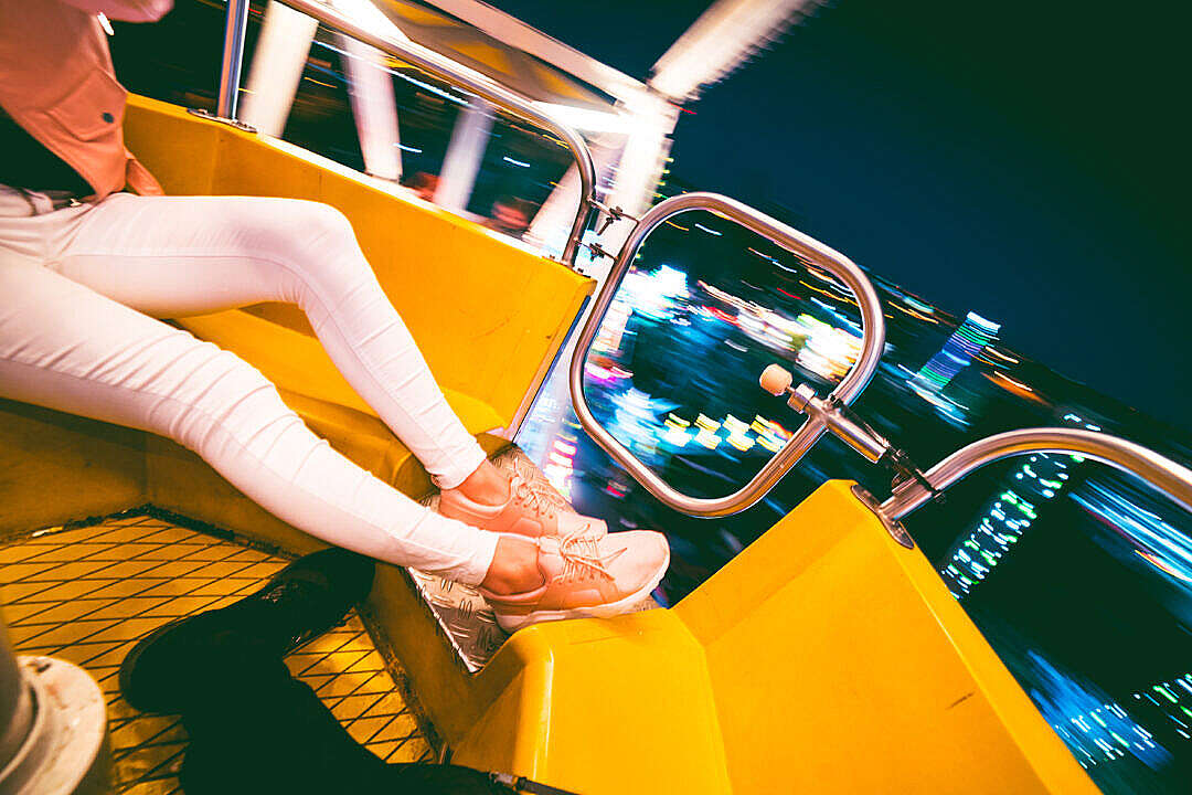 Download Enjoying Crazy Ferris Wheel in Amusement Park at Night FREE Stock Photo