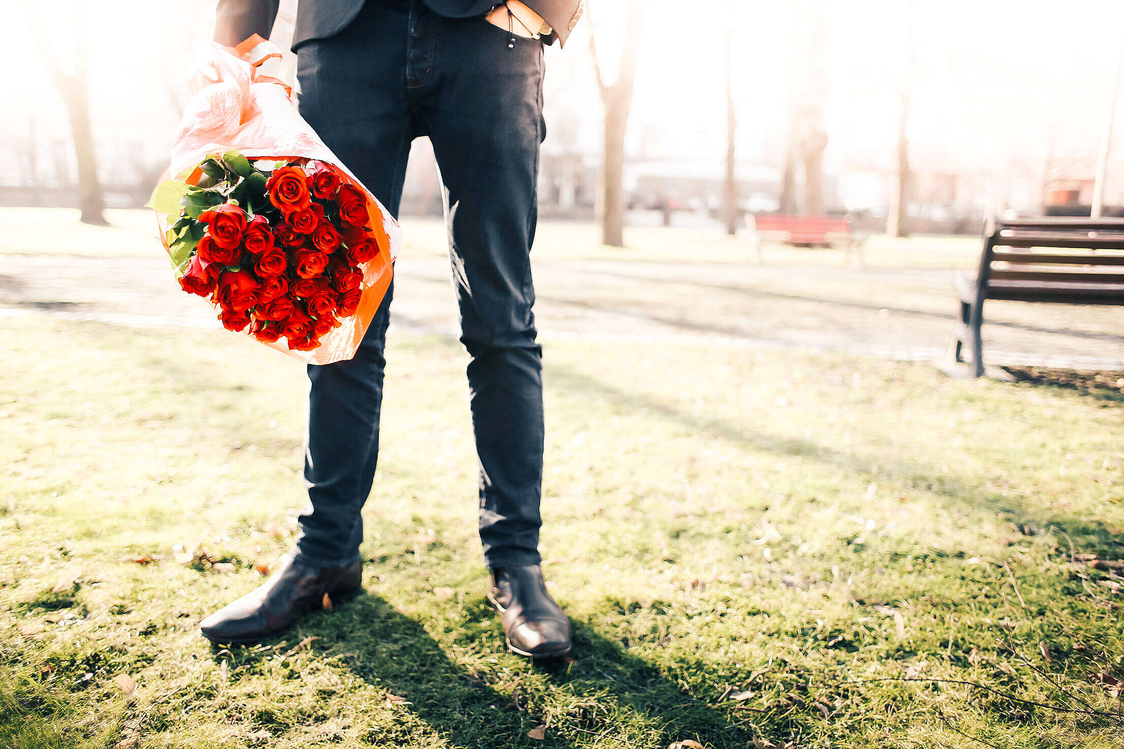 Gentleman Holding a Bouquet of Roses Free Stock Photo