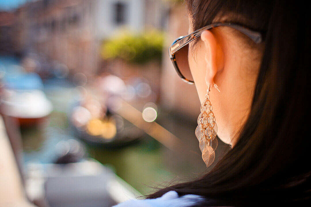 Download Girl Looking at Venice Gondola FREE Stock Photo