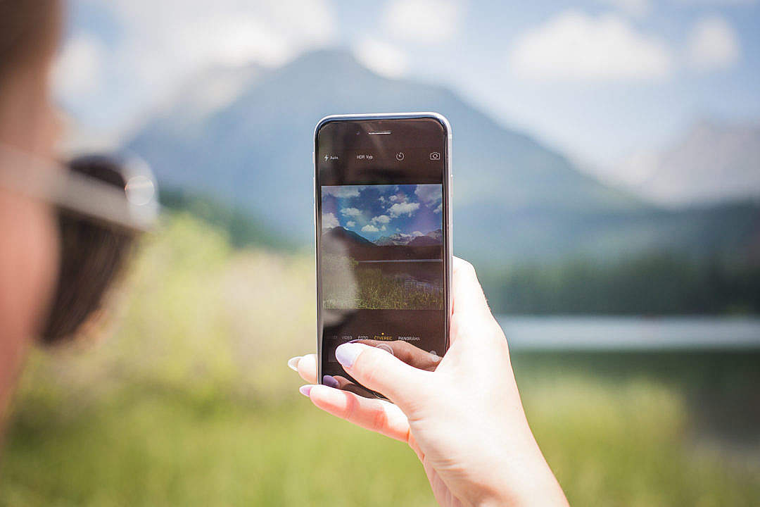 Download Girl Taking a Photo of Mountains FREE Stock Photo