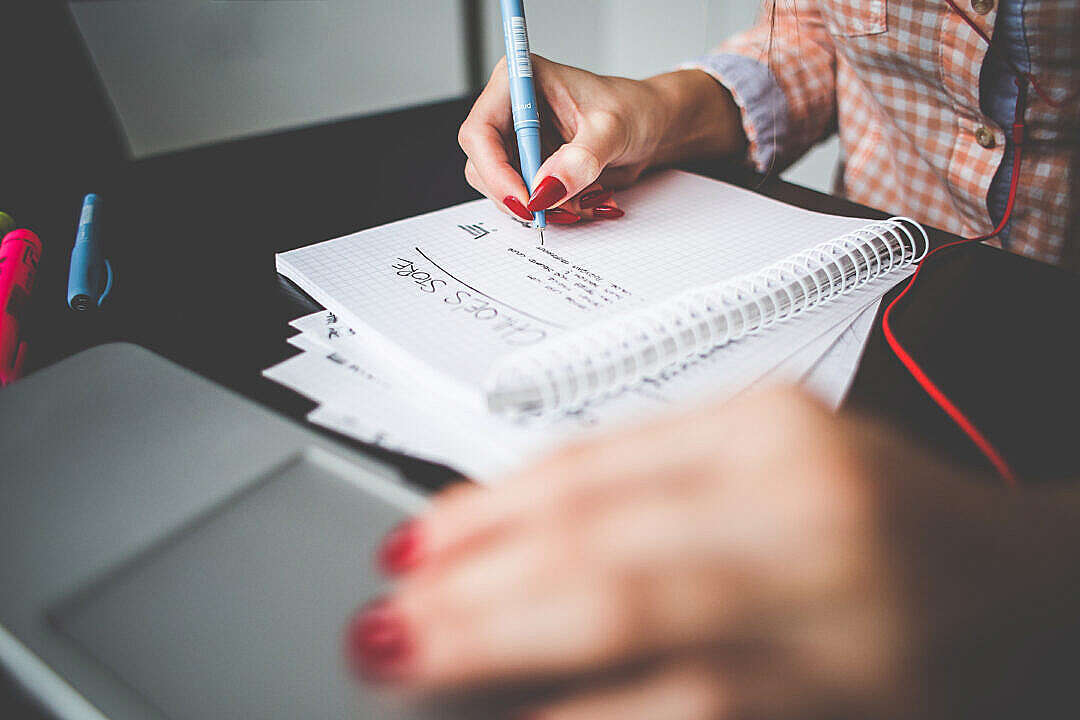 Girl Writing a Project To-Do