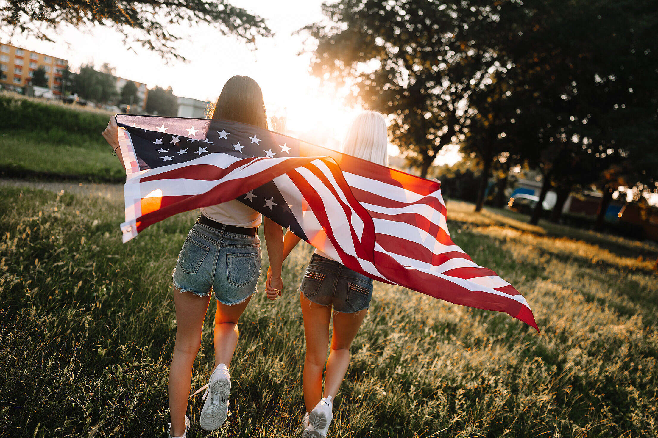 Girls with The American Flag Enjoying Independence Day Free Stock Photo