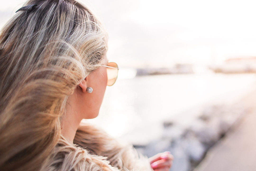 Glamorous Woman with Curly Hair and Sunglasses