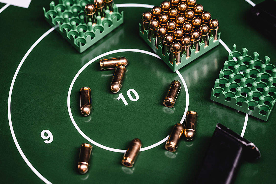 Green Shooting Target with a Lot of 9mm Ammunition