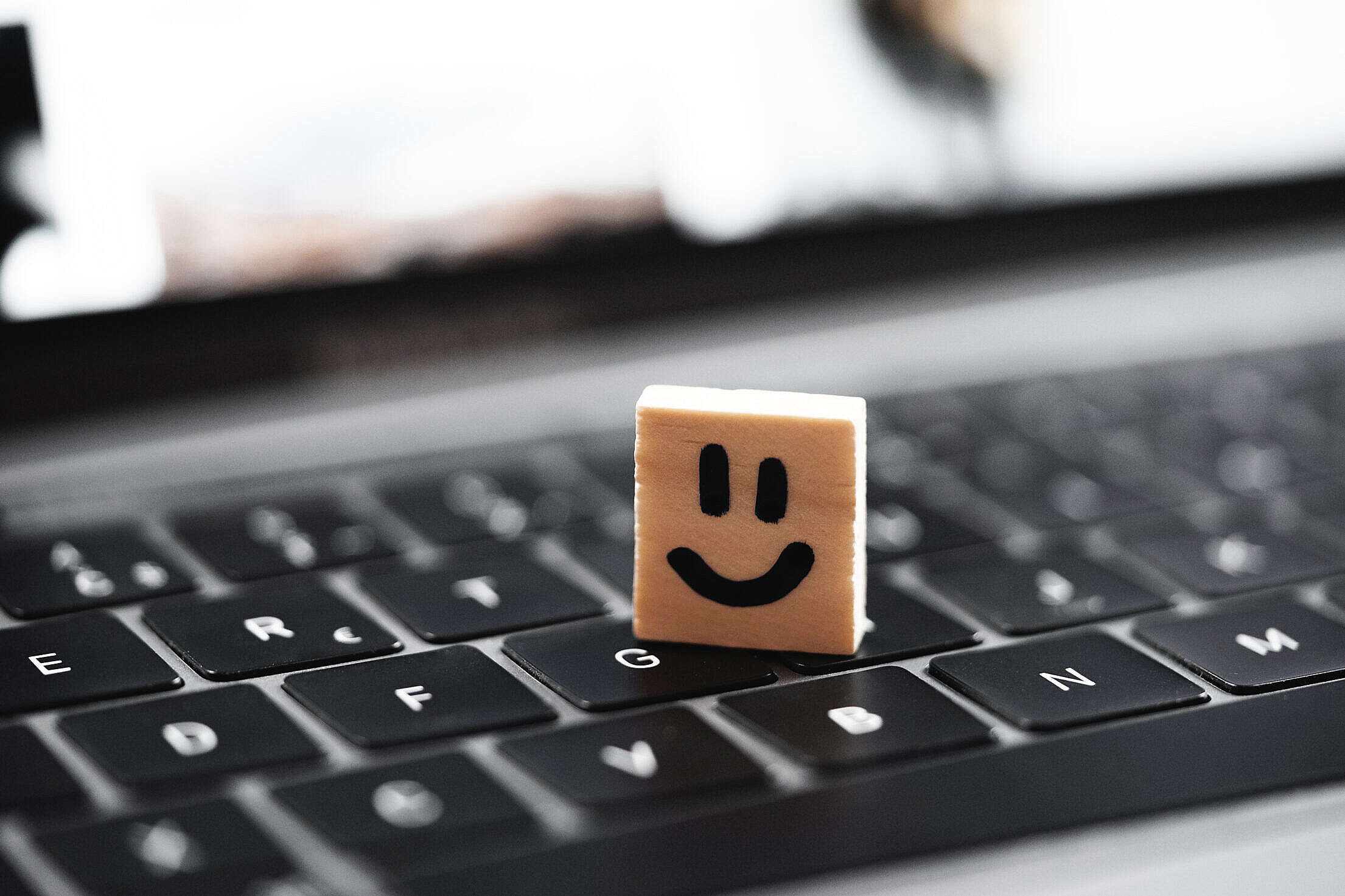 Happy Smiley on Laptop Keyboard Free Stock Photo