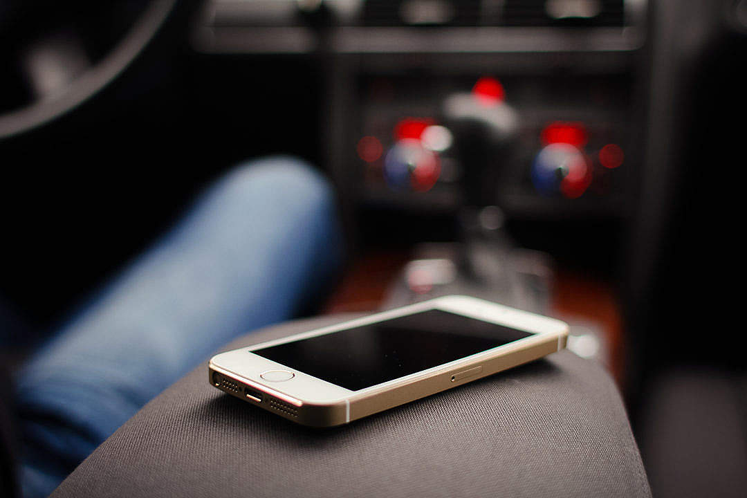 Download iPhone 5S Gold in Car FREE Stock Photo