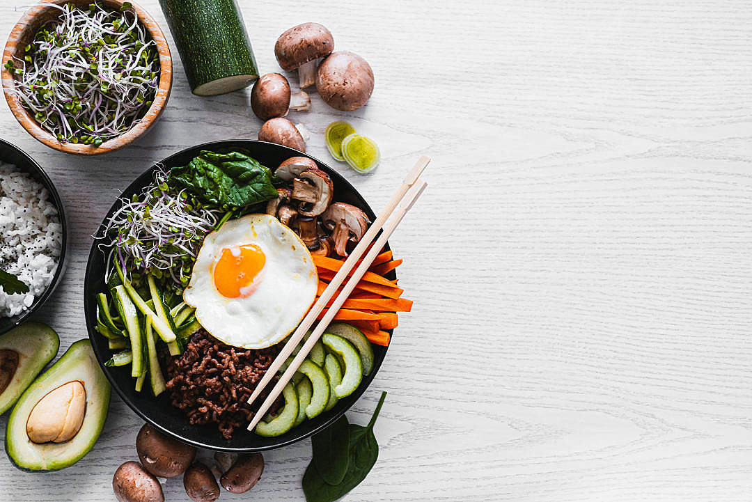 Korean Bibimbap on a White Table with a Space for Text