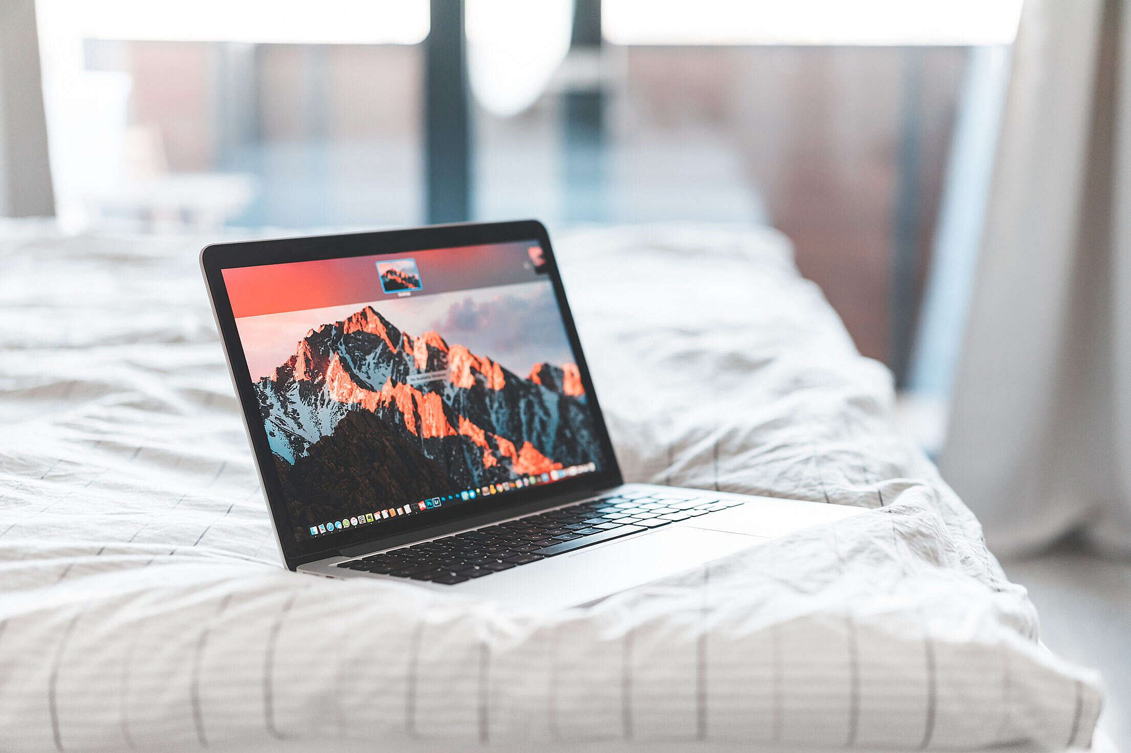 Laptop in Bed Free Stock Photo