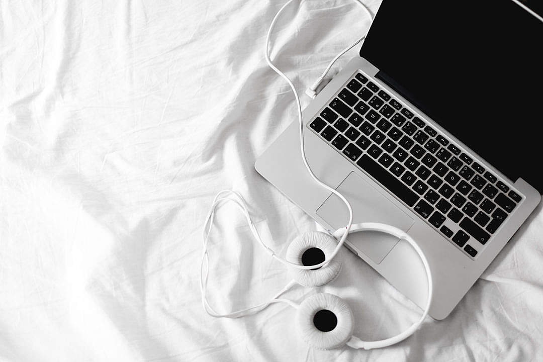 Download Listening Streaming Music in Bed Headphones FREE Stock Photo