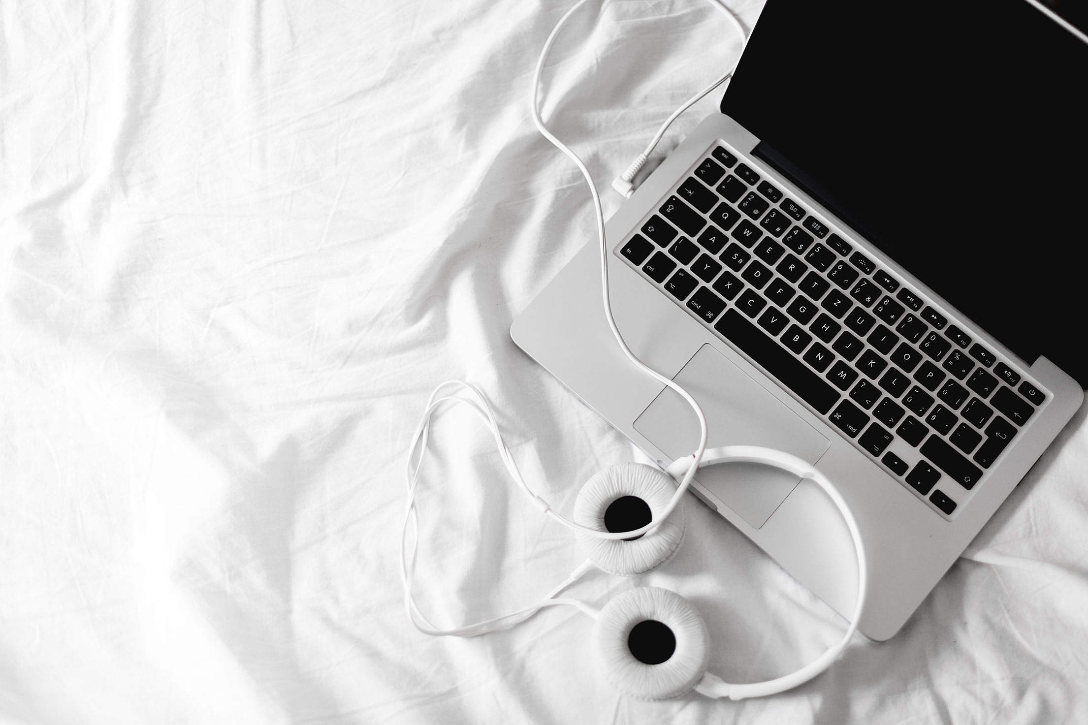 Listening Streaming Music in Bed Headphones Free Stock Photo