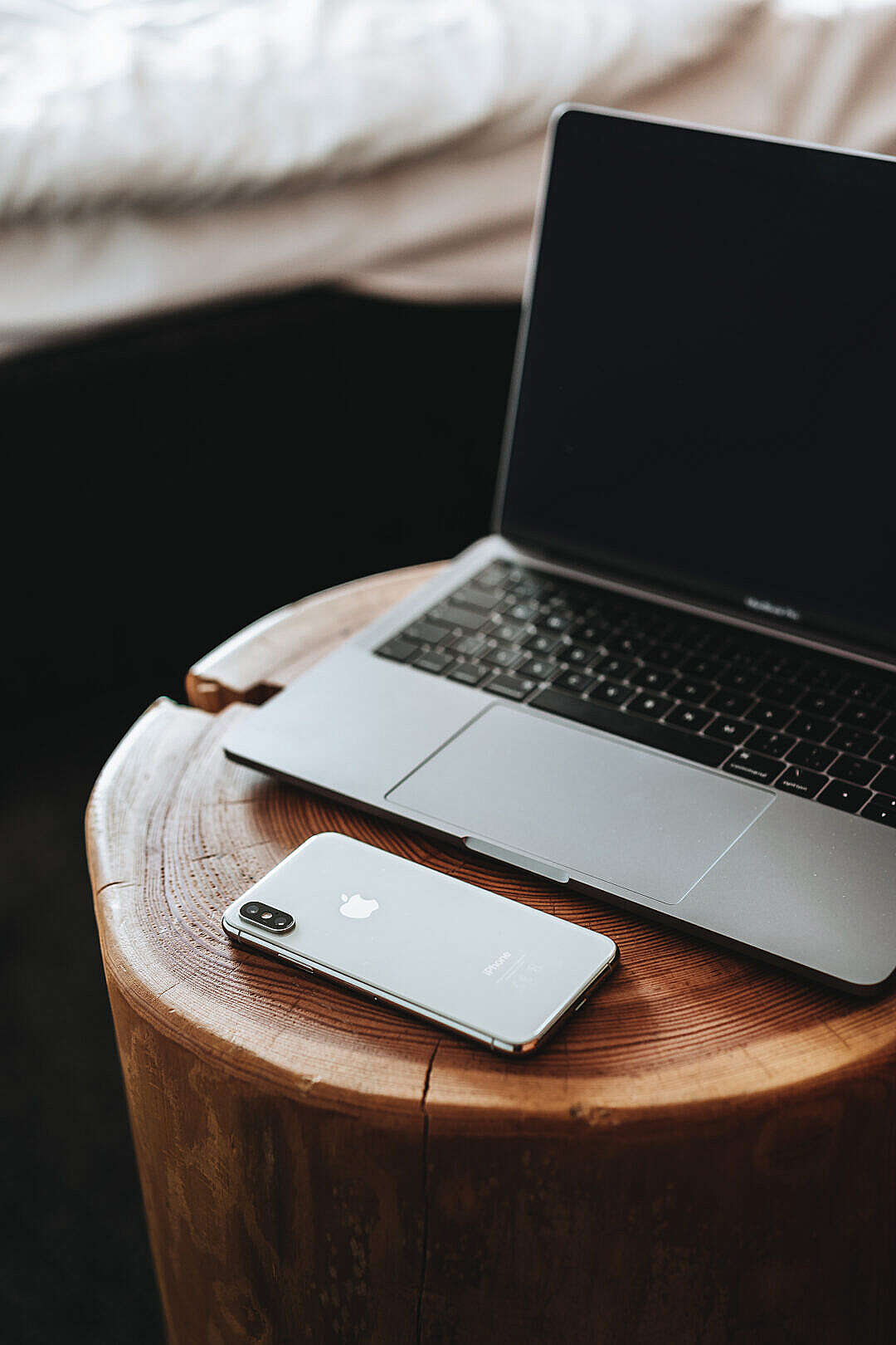 MacBook and iPhone XS on Wooden Table