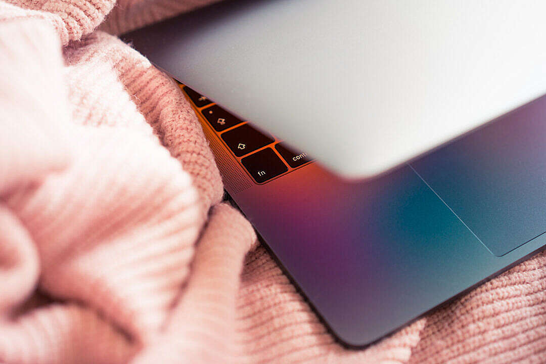 MacBook in Pink Sweater