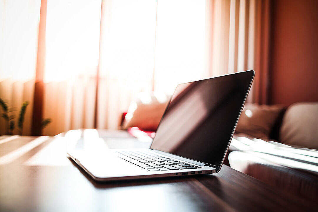 Download MacBook on Living Room Table FREE Stock Photo