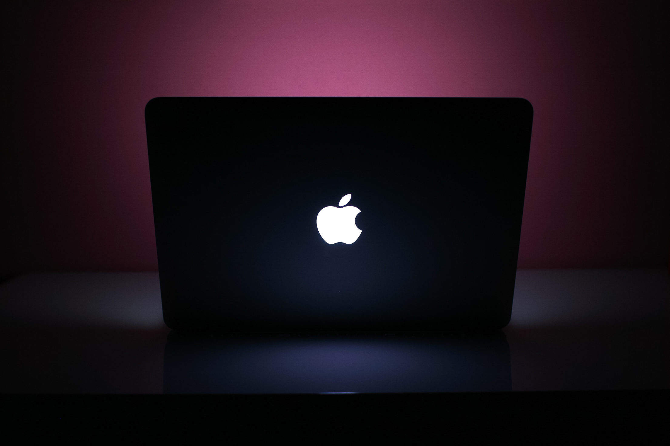 MacBook Pro at Pink Night Free Stock Photo