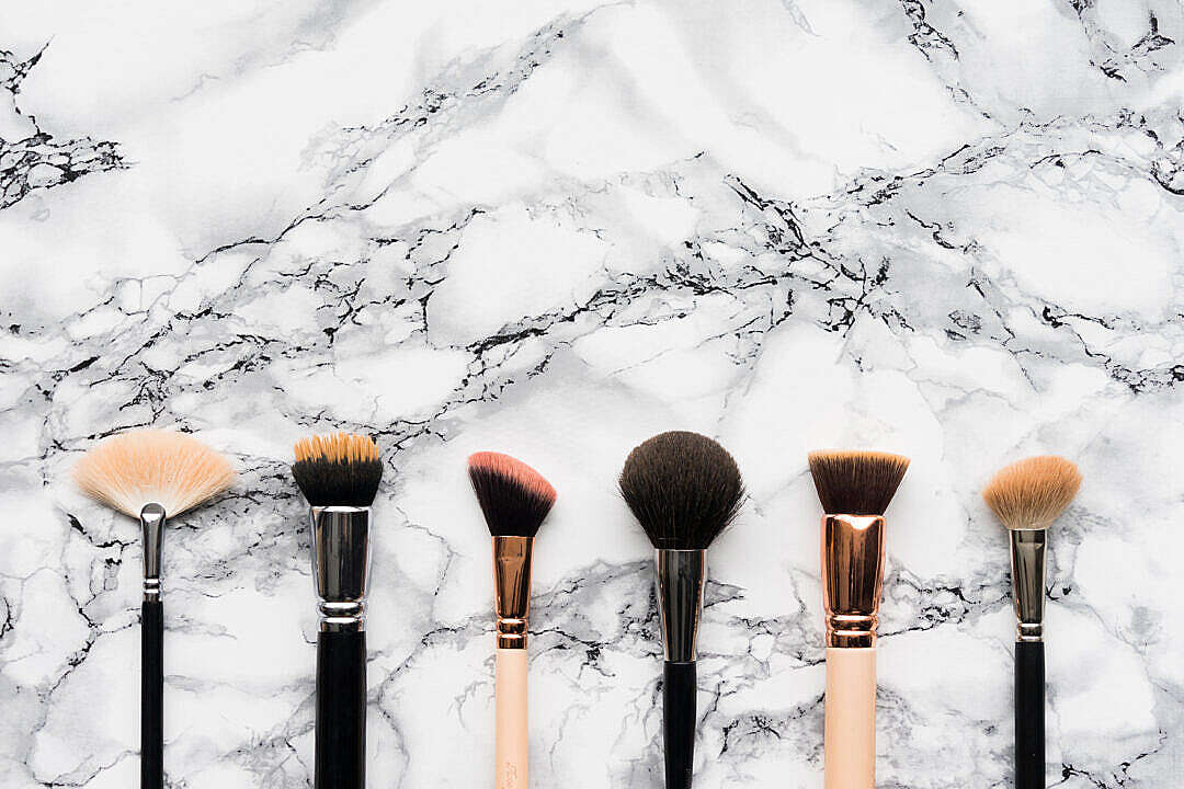 Makeup Brushes on White Marble Background