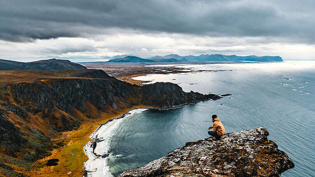Download Man Enjoying a Moody View to the Norwegian Landscape FREE Stock Photo