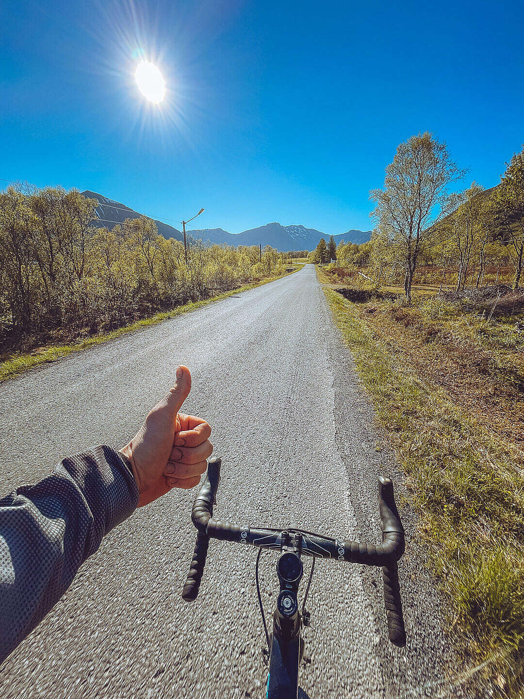Download Man Enjoying Sunny Weather on a Bicycle FREE Stock Photo