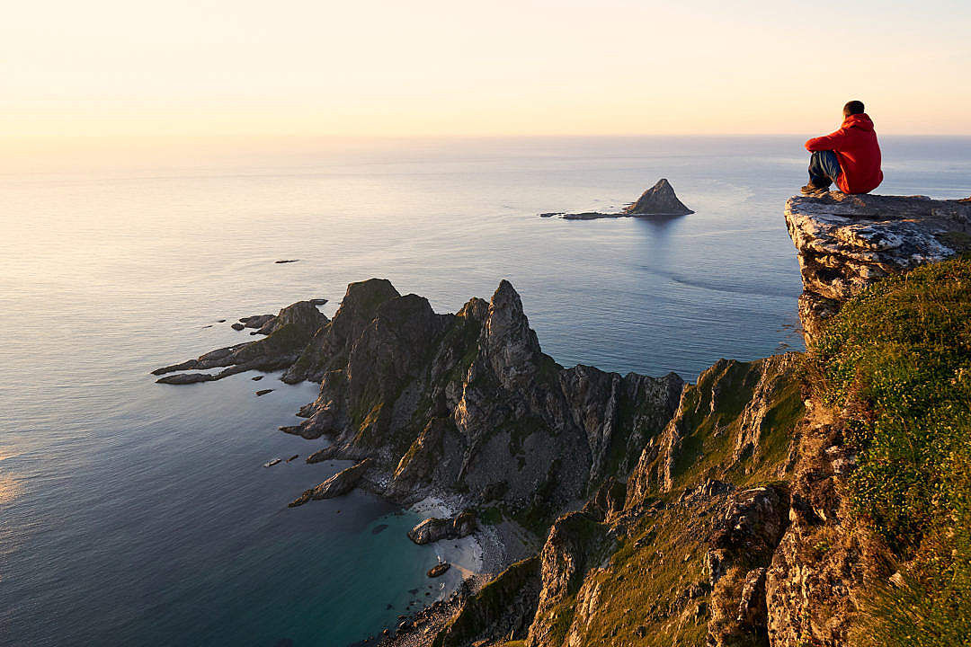 Man Enjoying the View from the Edge of the Cliff