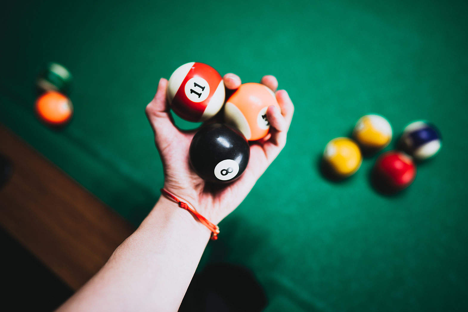 Man Holding Vintage Billiard Balls in His Hand Free Stock Photo picjumbo