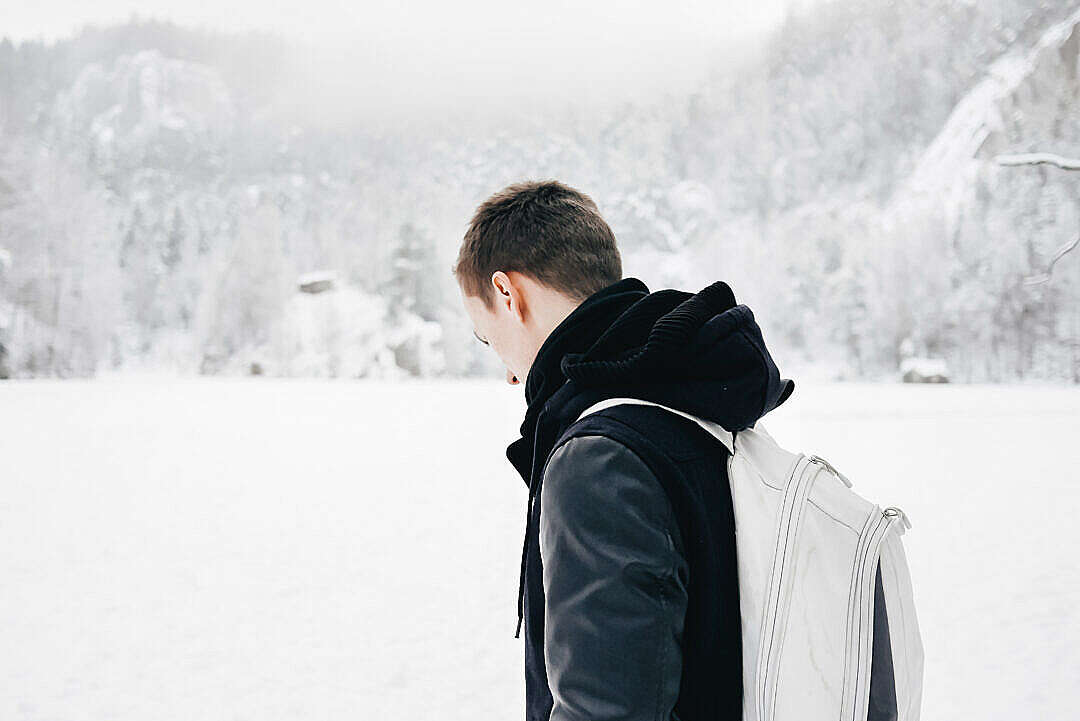 Man in the Middle of Snowy Valley