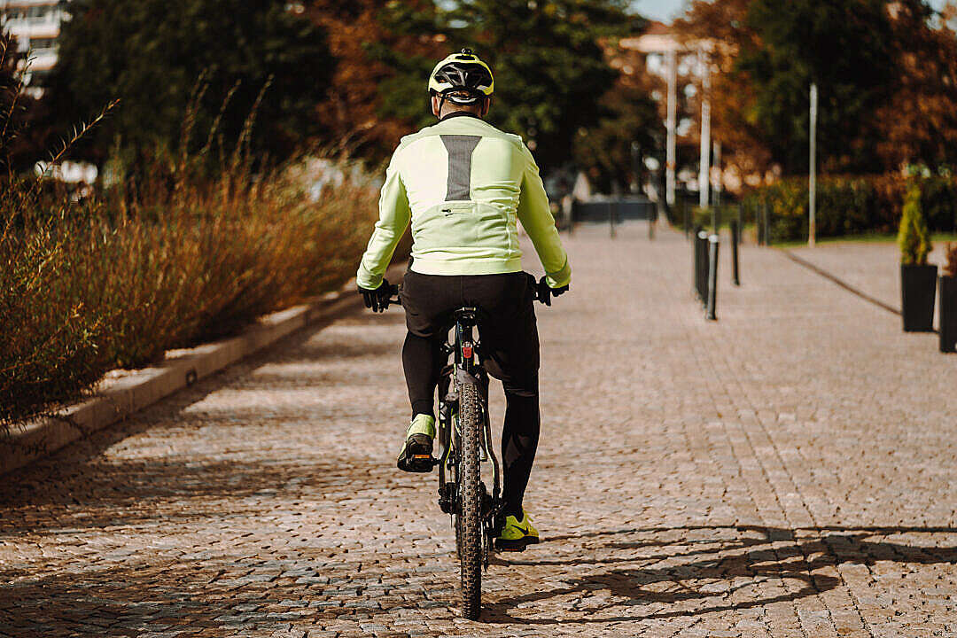 Man on a Bike in Fall