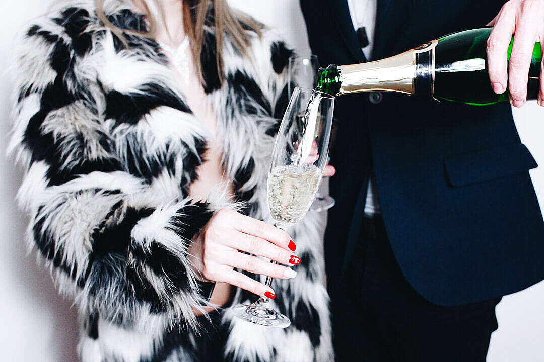 Man Pouring Glass of Champagne